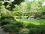 overview into garden with fountain and pergola